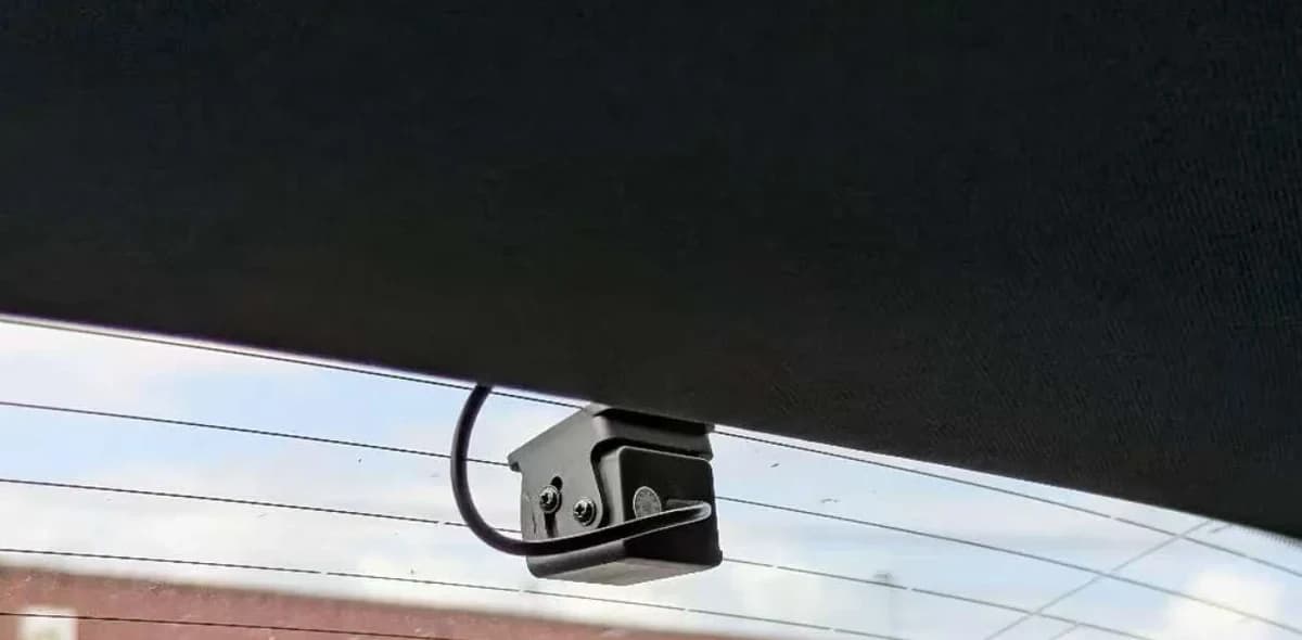 Rear dash cam mounted at the top of the rear windscreen on a Mercedes-Benz C-Class